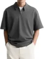 Close-up view of dark grey half-zip polo shirt collar and metallic zipper detail. - L / Gray
