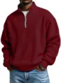 Detailed view of the burgundy waffle knit quarter-zip sweatshirt showing fabric texture. - S / Burgundy
