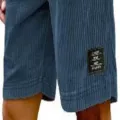 Detailed view of men's vintage corduroy casual shorts in dark blue with fabric texture and hem label. - S / Navy Blue