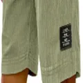Close-up view of men's vintage corduroy casual shorts showing textured fabric and woven label. - S / Light Green
