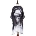 Vintage skull print hairdressing cape, waterproof salon hair cutting gown for professional styling. - Black and White