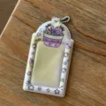 Close-up detail of the cute pink strawberry cake design 3-inch photocard holder pendant. - Strawberry Milk Tea 3-Inch Card Sleeve