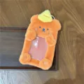Cute orange plush 3-inch photocard holder with yellow hat, ideal for idol cards. - Bear Plush Card Holder / Orange