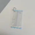Vista detallada de bolsa de almacenamiento de muñecas de PVC transparente caramelo. - Bolsa de muñeca de caramelo azul
