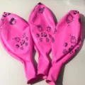 Pink 36-inch latex balloon with cute cartoon animal prints, perfect for party and event decor. - Animal