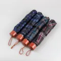 Paraguas plegable de cuadros portátil con estuche de cápsula, miniparasol compacto para viajes. - Cuadros 7K [colores aleatorios]