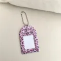 Detailed close-up shot of the pink leopard print acrylic photocard holder keychain pendant. - Leopard Print Small Card Holder