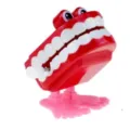 Lustiges Aufzieh Zähne Spielzeug mit großen Augen und Füßen für Halloween Weihnachtsgeschenk - Rote Springende Zähne