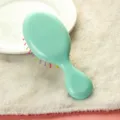 Mini cepillo de pelo verde menta, peine de masaje con cojín de aire de plástico de color caramelo. - Azul claro