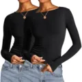 Detailansicht des figurbetonten schwarzen Langarmtops für Damen mit klassischem Rundhalsausschnitt. - XS / Ganz Schwarz