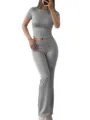 Grey short sleeve crop top and flared pants set detail view showing soft shimmering fabric. - XS / Top And Bottom / Light Gray