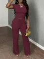 Detailed view of the burgundy short-sleeve top and wide-leg lounge pants set worn by model. - XS / Top And Bottom / Burgundy