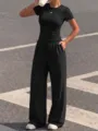 Detailed view of the black casual short sleeve t-shirt and drawstring wide leg trousers set. - XS / Top And Bottom / Deep purple