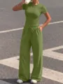Green two-piece lounge set detail showcasing short sleeve top and comfortable drawstring trousers. - XS / Top And Bottom / Matcha Green