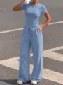Casual blue two-piece lounge set featuring a fitted short sleeve top and wide leg pants. - XS / Top And Bottom / Light Blue