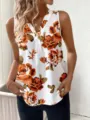 Close-up detail van dames bloemenprint V-hals mouwloze top, casual stijl voor zomer. - Oranje