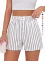 Detail view of women's casual striped high-waist boxer shorts, loose fit and comfortable. - Beige & Black Stripes