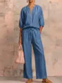 Detailed view of women's casual solid color zip-up top and wide leg pants set outfit. - Denim Blue