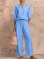 Detailed view of the stylish light blue casual zip-up top and wide-leg trouser set. - S / Top And Bottom / Light Blue