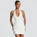 White halter pleated backless dress detail view, showing the sleeveless cut and elegant draping. - XS / Dresses / White