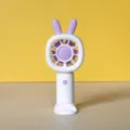 Kompakter tragbarer Mini-Handventilator mit Hasenohren, USB-Akkubetrieb, in Weiß und Lila. - Hasenform (JS55) / Weiß