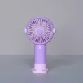 Tragbarer Handheld-Miniventilator in Helllila mit Sockel, kompaktes USB-Lade-Gerät. - XY022 Wiederaufladbarer Ventilator (2 Stufen) Lila