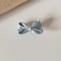 Light blue satin bow hair clip detail shot, cute hair accessory for kids and girls. - Milk Blue Bowknot Hair Clip