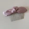 Pink satin bow hair comb detail view, elegant fabric knot with silver metal teeth accessory. - Pink Knotted Bowknot - Hair Comb