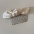 Beige satin bow hair comb detail view, elegant fabric hair accessory with metal teeth. - Beige Knotted Bowknot - Hair Comb