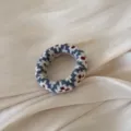 Suave coletero de punto para otono e invierno con patron de puntos rojos y azules. - Azul a Cuadros Tela