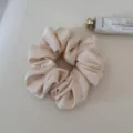 Soft satin hair scrunchie for women, elegant daily hair tie ponytail holder in light beige. - Beige