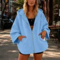 Detail view of women's casual solid color light blue zip-up hooded sweatshirt with pockets. - S / Sky Blue