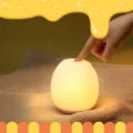 Creative cute silicone night light with warm glow, USB rechargeable bedside lamp for bedroom. - Lucky Egg / Yellow