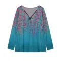 Detailed view of the V-neck long sleeve top featuring a chic ring zipper and vibrant floral print. - Light Blue