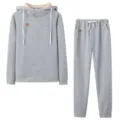 Grey fleece hoodie and sweatpants two-piece set detail view with small leather patch. - S / Top And Bottom / Light Gray