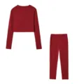 Detailed view of the women's solid red long-sleeve crop top and matching slim pants set. - Burgundy