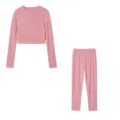 Pink long sleeve top and pants detail view showing soft fabric and slim fit design. - Pink