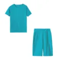 Primer plano del tejido deportivo turquesa con textura de panal, vista detallada del conjunto. - S / Top y Pantalones / Azul lago