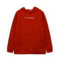 Detailed view of red fleece-lined hoodie with inspirational chest text, kangaroo pocket and drawstring. - Red