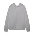 Detailed view of white jacquard knit hoodie featuring long sleeves and adjustable drawstring hood. - S / Tops / White