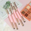 Set of 7 double-ended makeup brushes with pink handles and eyeshadow palette detail view. - 5-Piece Small Set