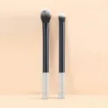 Detail view of a 2-piece makeup brush set with crystal handle, soft bristles for eye shadow. - Black