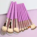 Detailed view of a 10-piece purple makeup brush set featuring soft bristles and rose gold. - 10 Piece Set / Purple