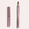 Pink metal retractable lip brush for precise makeup application, portable cosmetic tool. - Rose Gold