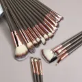 Detailed view of the 20-piece brown makeup brush set featuring soft bristles for eyes and face. - 20 Piece Set / Brown (Three-tone Hair)