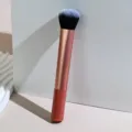 Detail shot of a professional long handle makeup foundation brush with soft synthetic bristles. - Foundation Brush 02