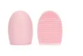Pink silicone makeup brush cleaner egg tool for deep cleaning cosmetic brushes efficiently. - Pink