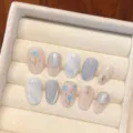 Handmade press on nails set with blue tulip painting, cat eye glitter, and rhinestone decor. - Extra Small (XS) / Medium Round Style (1638)