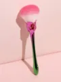Close-up detail of the rose-shaped makeup brush, showing soft gradient bristles and handle. - Pink Green Gradient