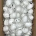 Bulk pack of white simulation squeeze eggs, stress relief toy detail view in carton box. - White Egg One Piece / White